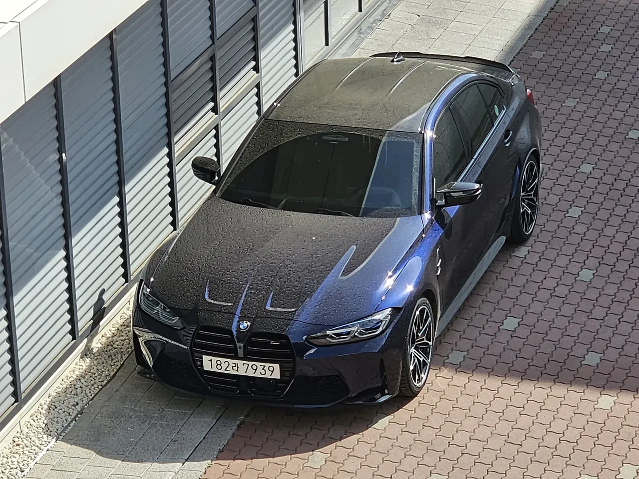 BMW M3 Competition · Elevated three-quarter