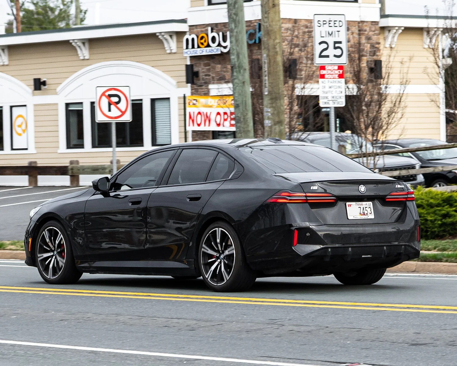 BMW i5 M60 xDrive · Rear three-quarter