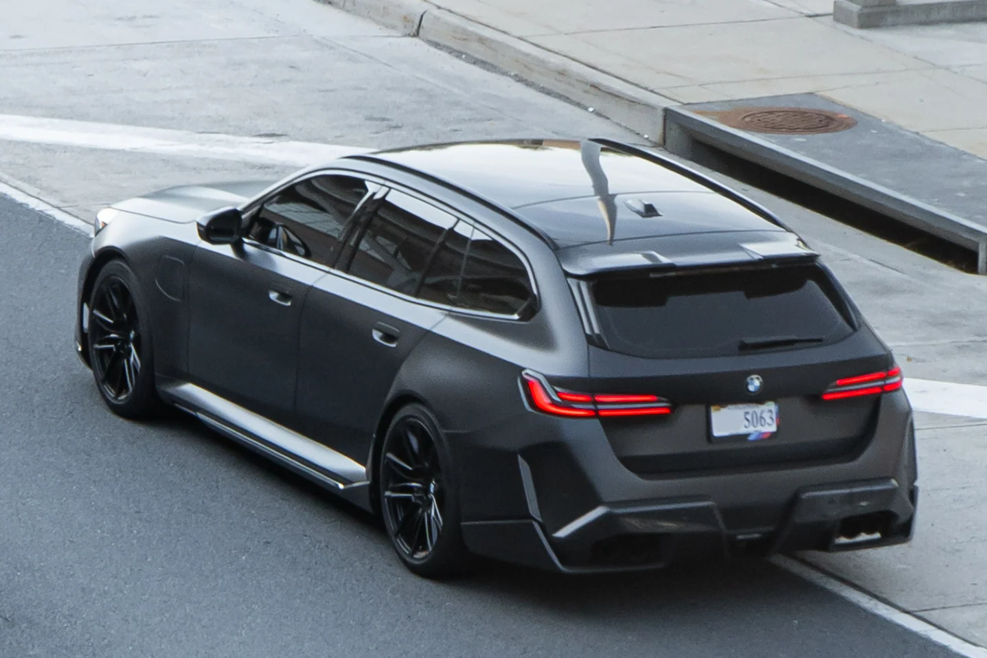 BMW M5 Touring M Hybrid · Rear three-quarter