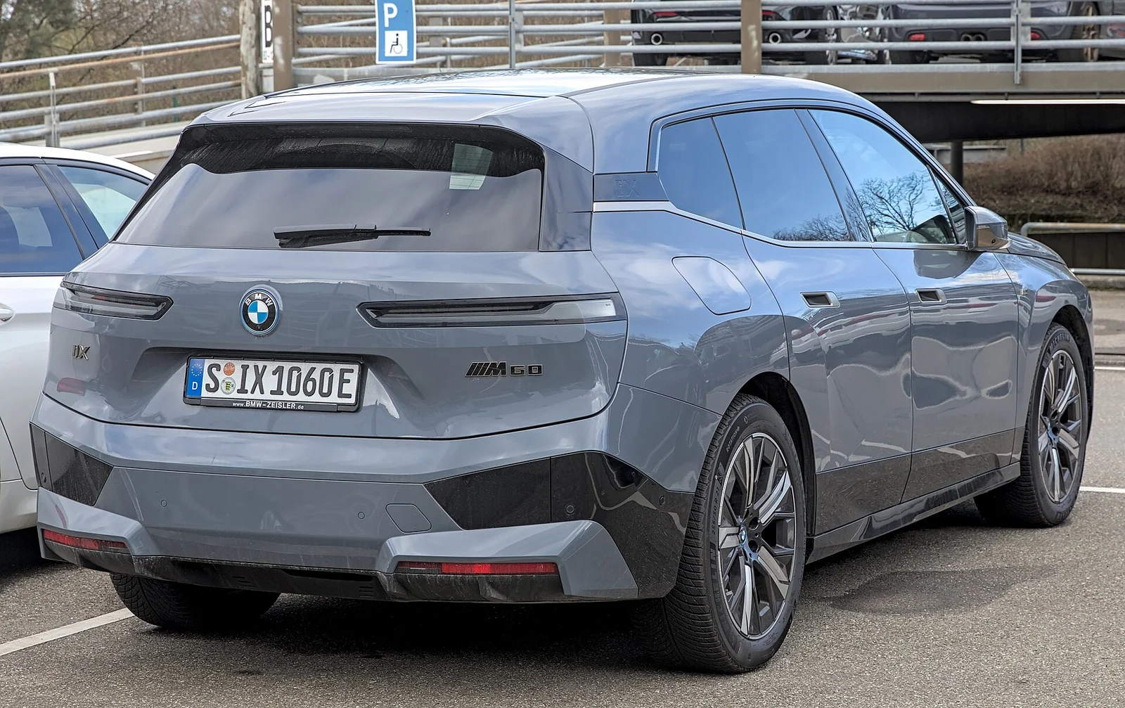 BMW iX M60 · Rear three-quarter
